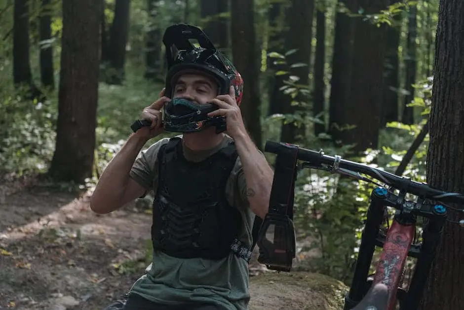 An image of an electric mountain bike with a person riding it in a forest trail